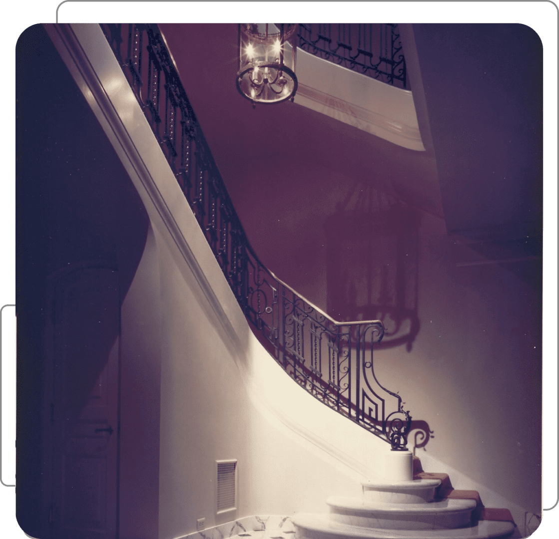 Elegant spiral staircase with ornate railing.