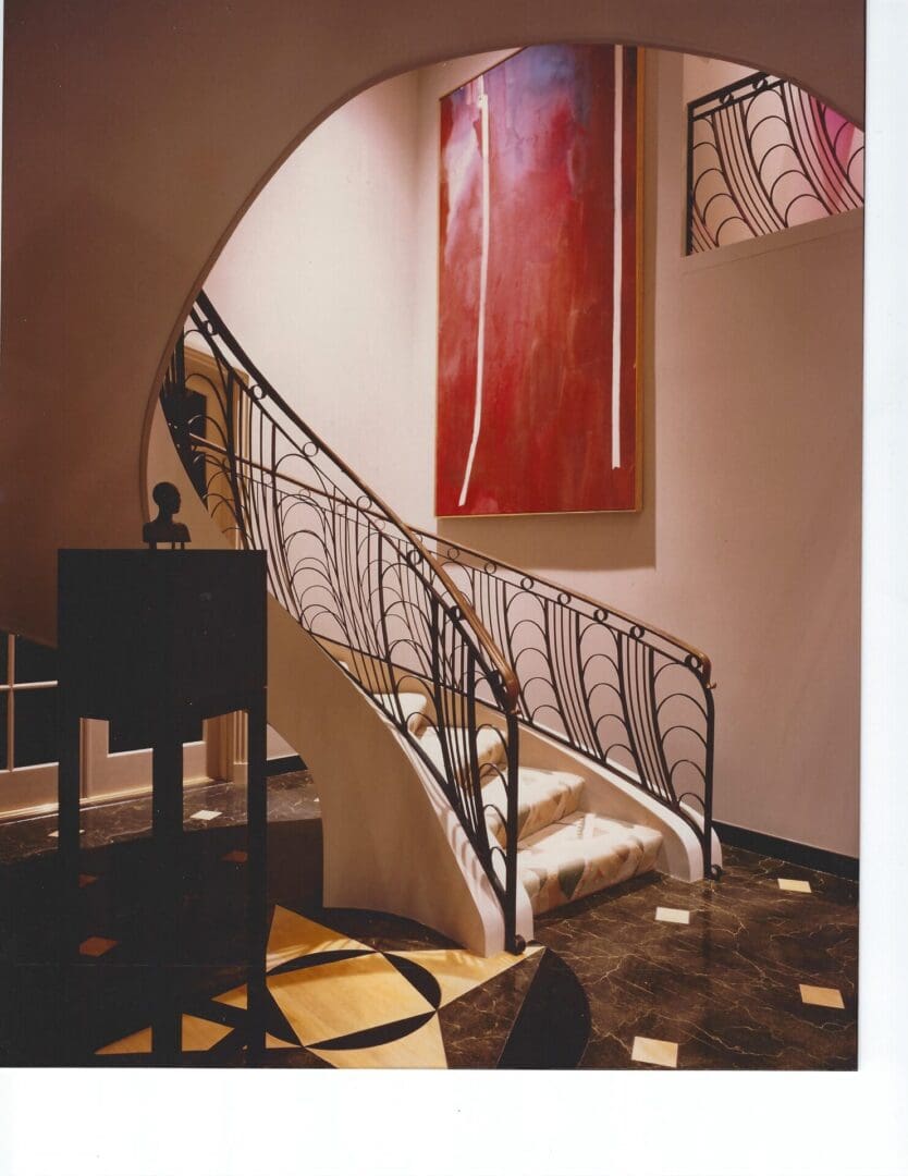 Elegant spiral staircase with modern art.